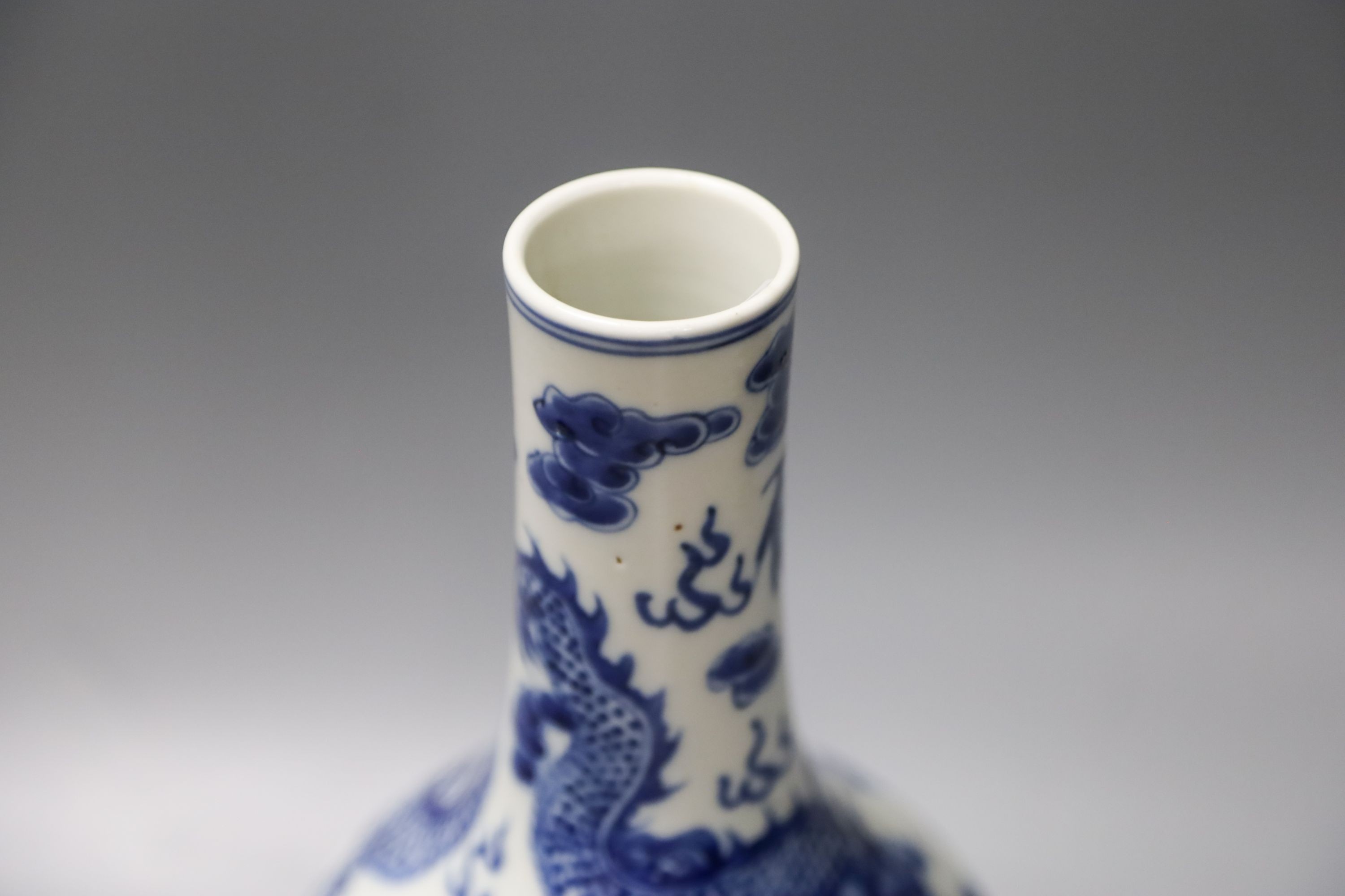 A Chinese blue and white dragon vase vase and Chinese green monochrome vase, mounted as a lamp 27cm